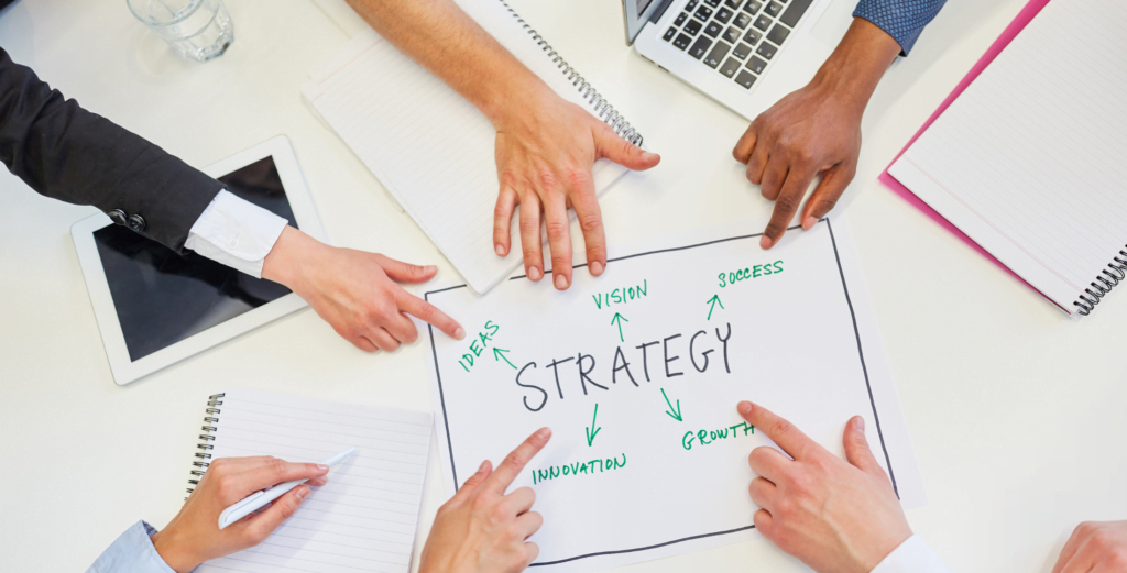 6 people pointing to strategy